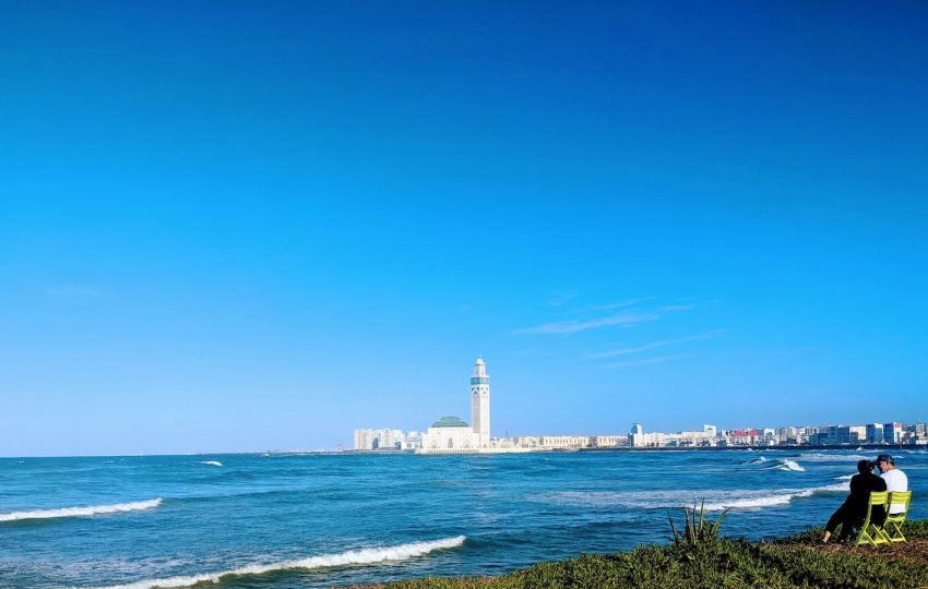 white lighthouse near body of water during daytime