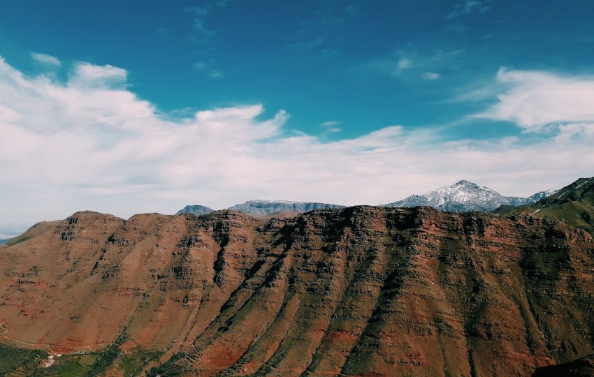 badland under white and blue sky